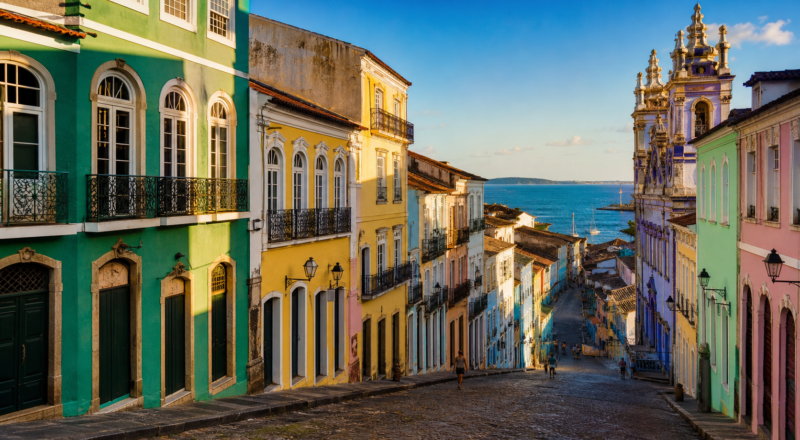 Historic center street in Bahia with colorful colonial houses and ocean view