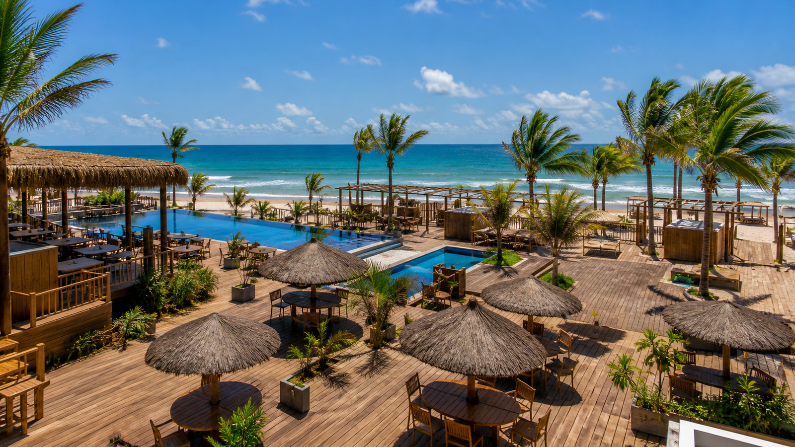 A large beach club with pools and umbrellas on the sand at Praia do Futuro