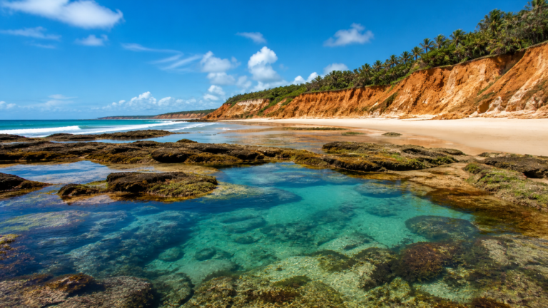Illustrative view of an empty Bahia beach with orange cliffs and natural pools.