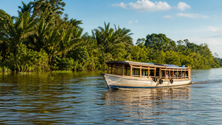 Belém Beyond the Obvious: 4 River Islands and Boat Trips Worth the Day Trip 8 Traditional wooden passenger riverboat navigating on the Guamá River near Belém Brazil surrounded by lush tropical rainforest