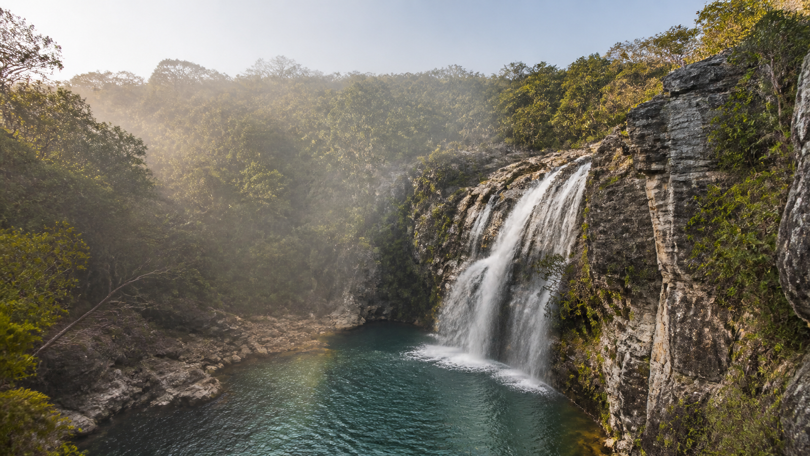 Pirenópolis Beyond the Crowds: 5 Quiet Waterfalls and Charming Streets You Need to Visit 2 Secluded waterfall cascading into a deep stone canyon pool at Cachoeiras dos Dragões in Pirenópolis, Brazil