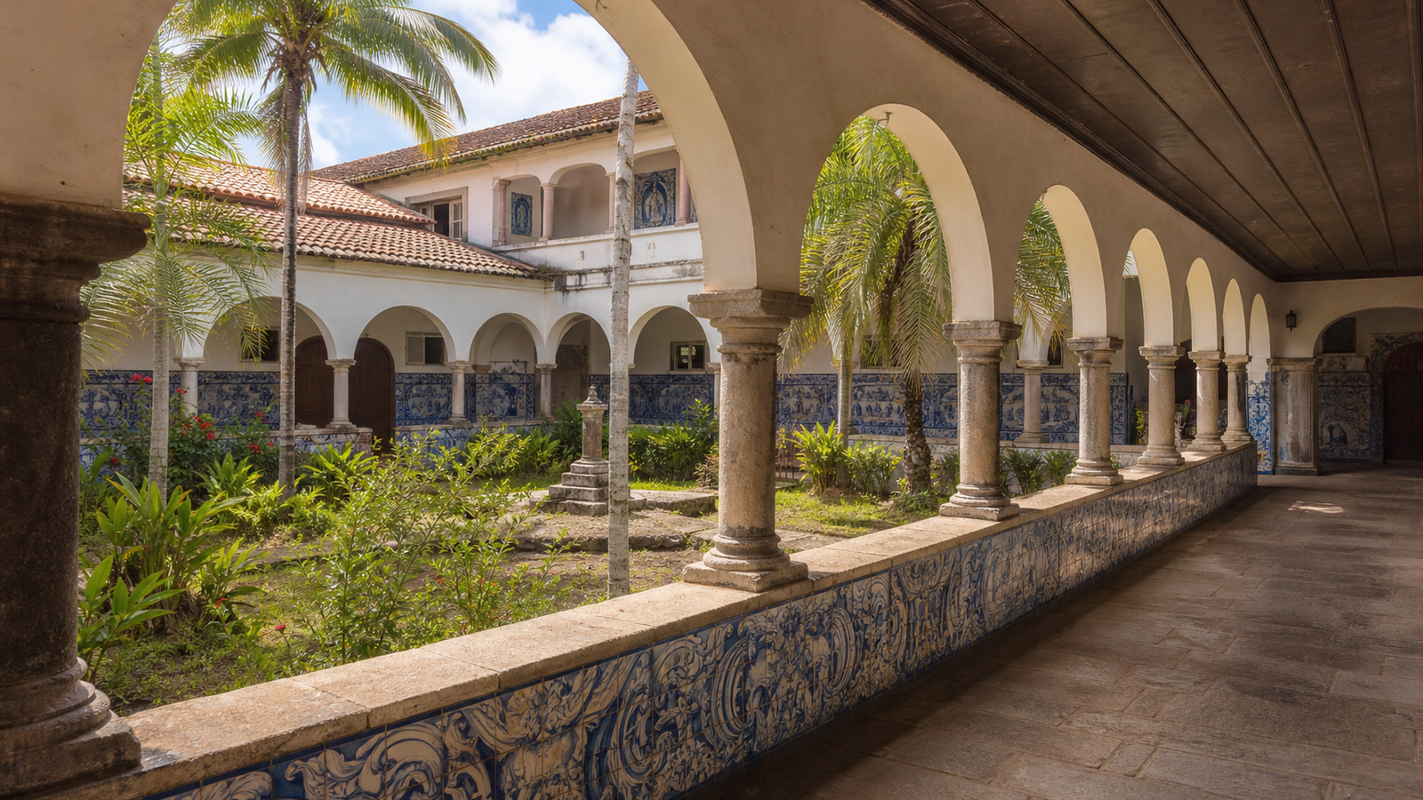 Colonial church courtyard with arched cloisters and blue-and-white Portuguese azulejos at Centro Cultural São Francisco in João Pessoa