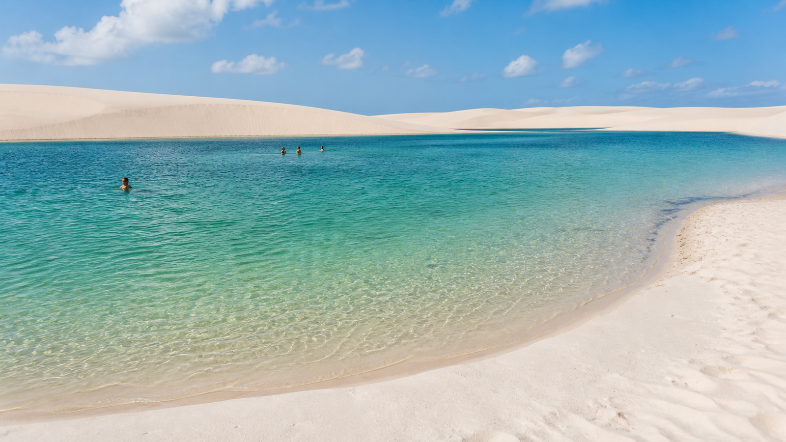 Lagoa Azul and Lagoa Bonita: The Honest Guide to Visiting Both Without Wasting Time or Money 2 Clear emerald freshwater lagoon surrounded by rolling white sand dunes at Circuito Lagoa Azul