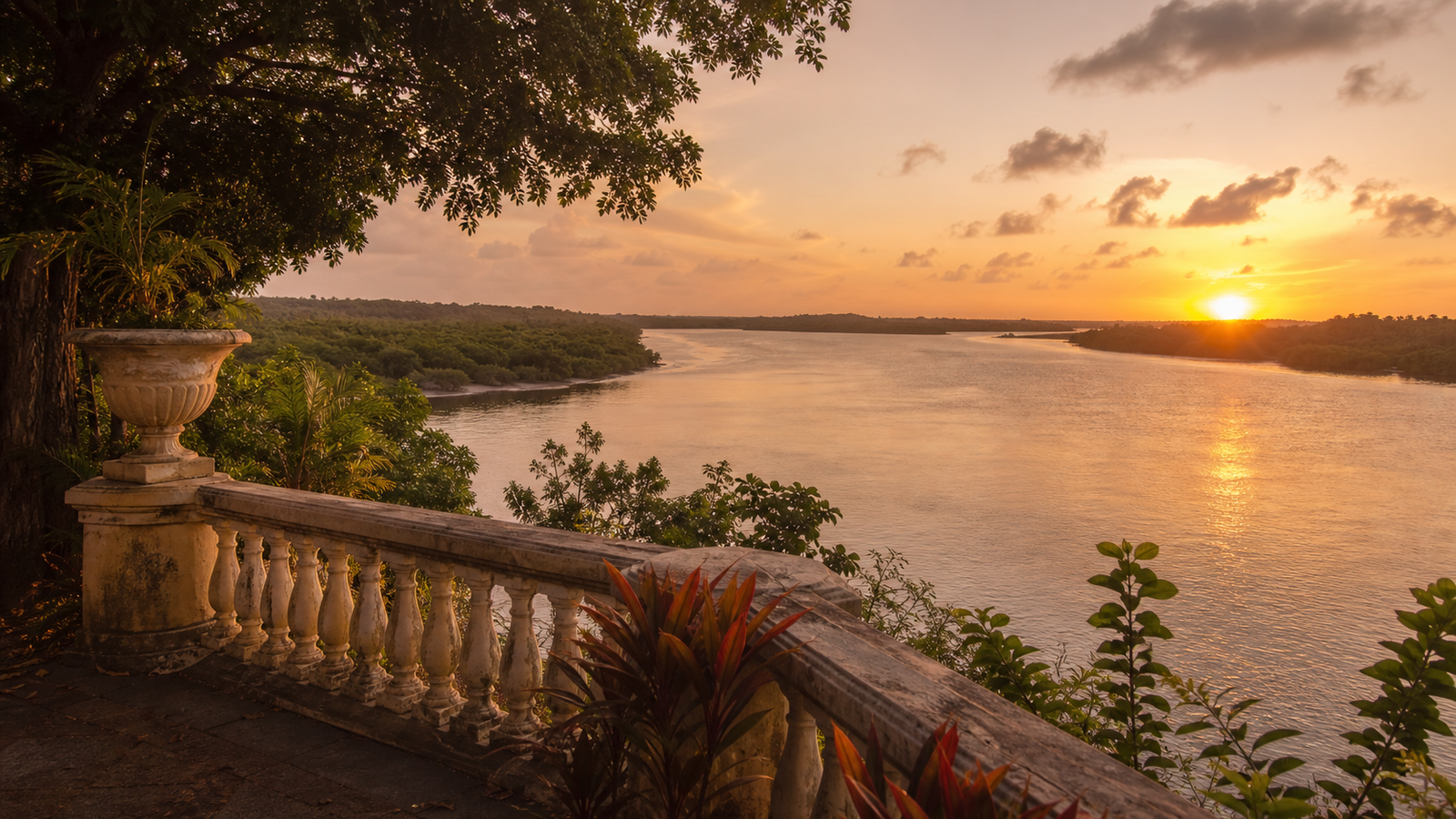Garden terrace viewpoint at Hotel Globo overlooking the Sanhauá River estuary and mangroves during golden hour in João Pessoa