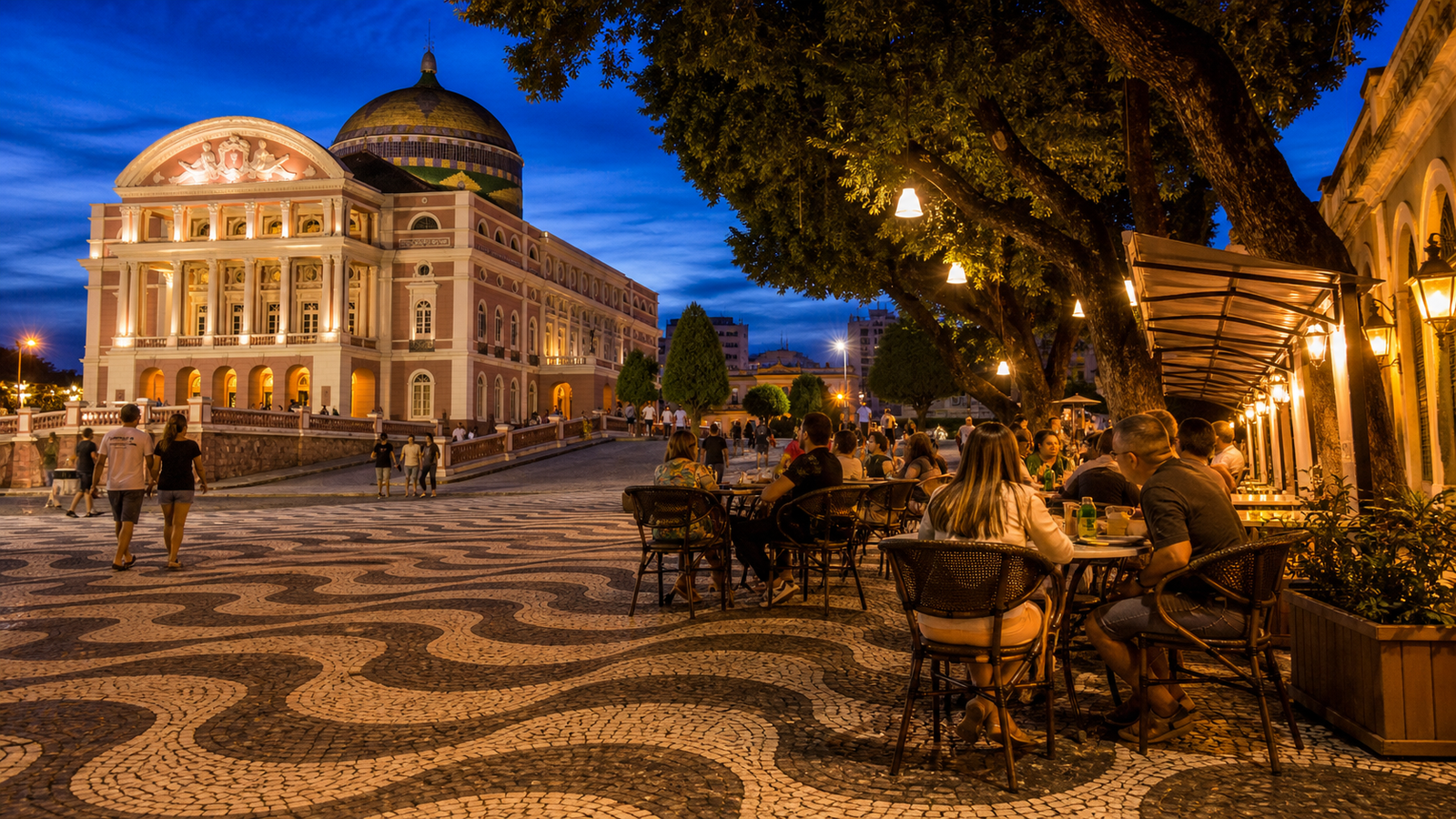 Largo de São Sebastião square at twilight with illuminated Teatro Amazonas and outdoor cafes