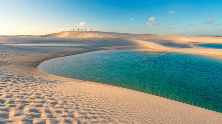 What to Do in Lençóis Maranhenses: The Realistic 3 to 4-Day Itinerary 5 Panoramic view of white sand dunes and turquoise freshwater lagoons in Lençóis Maranhenses National Park, Brazil.