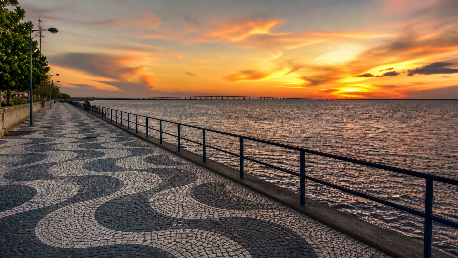 Manaus Beyond the River: 5 Unique Urban Spots You Need to Visit 4 Ponta Negra pedestrian promenade with Portuguese stone paving at sunset overlooking the Rio Negro in Manaus