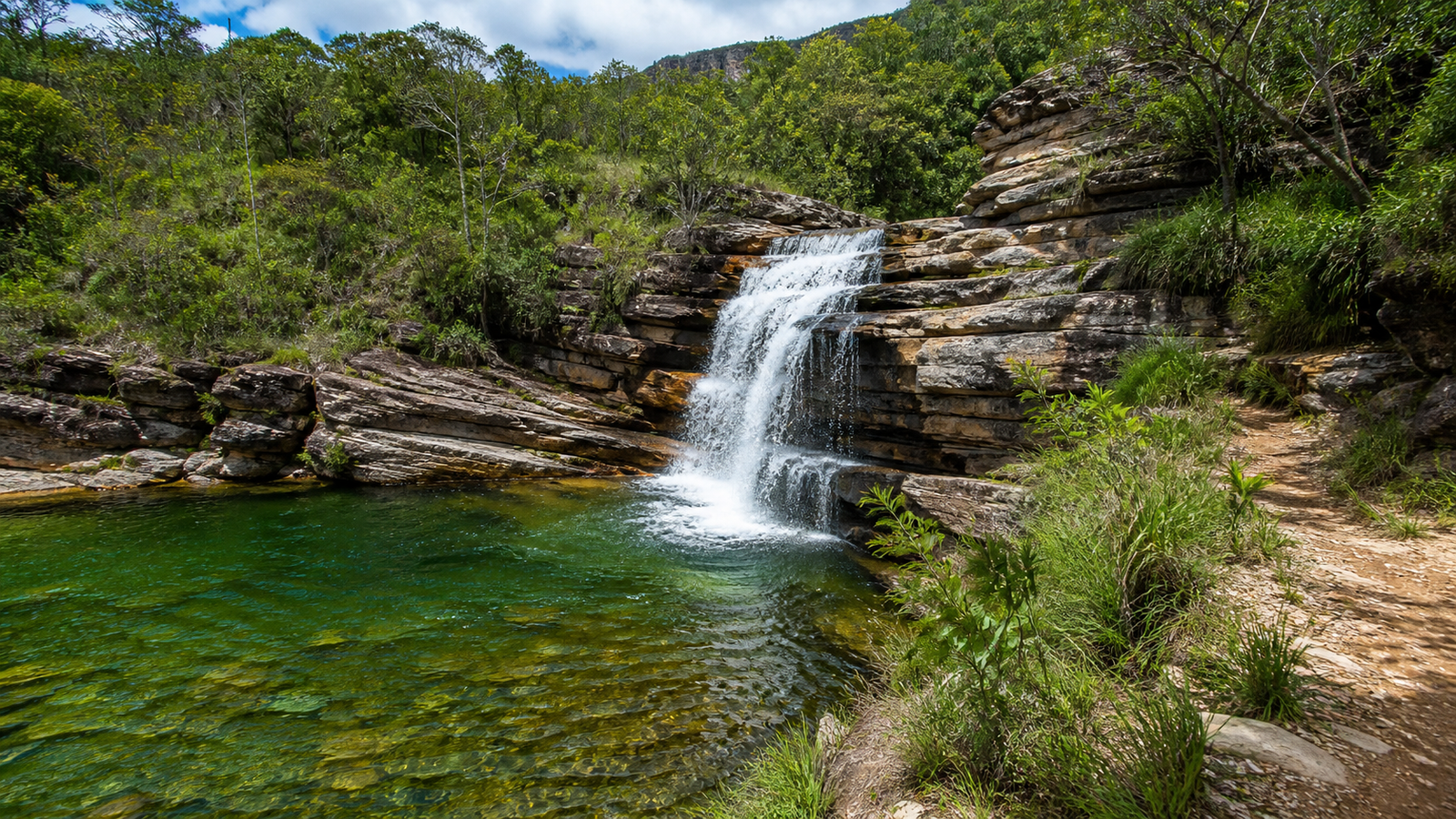Natural freshwater waterfall and mountain hiking trail in Serra de Caldas State Park Goiás