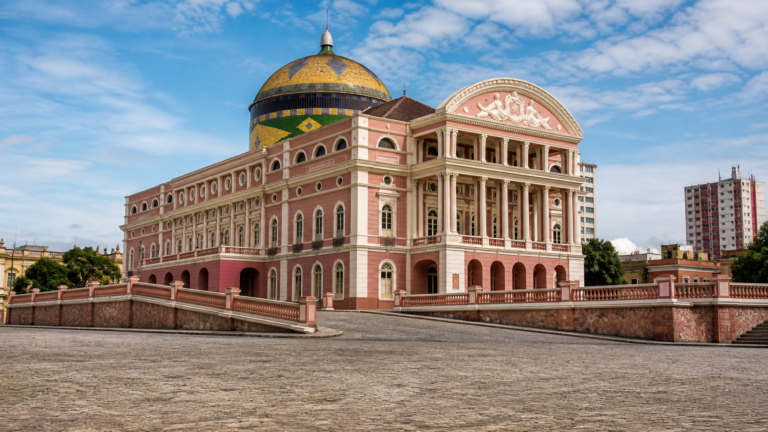 Teatro Amazonas in Manaus: How to Visit Without Wasting Time or Money 5 Exterior of Teatro Amazonas in Manaus showing its pink neoclassical facade and colorful dome