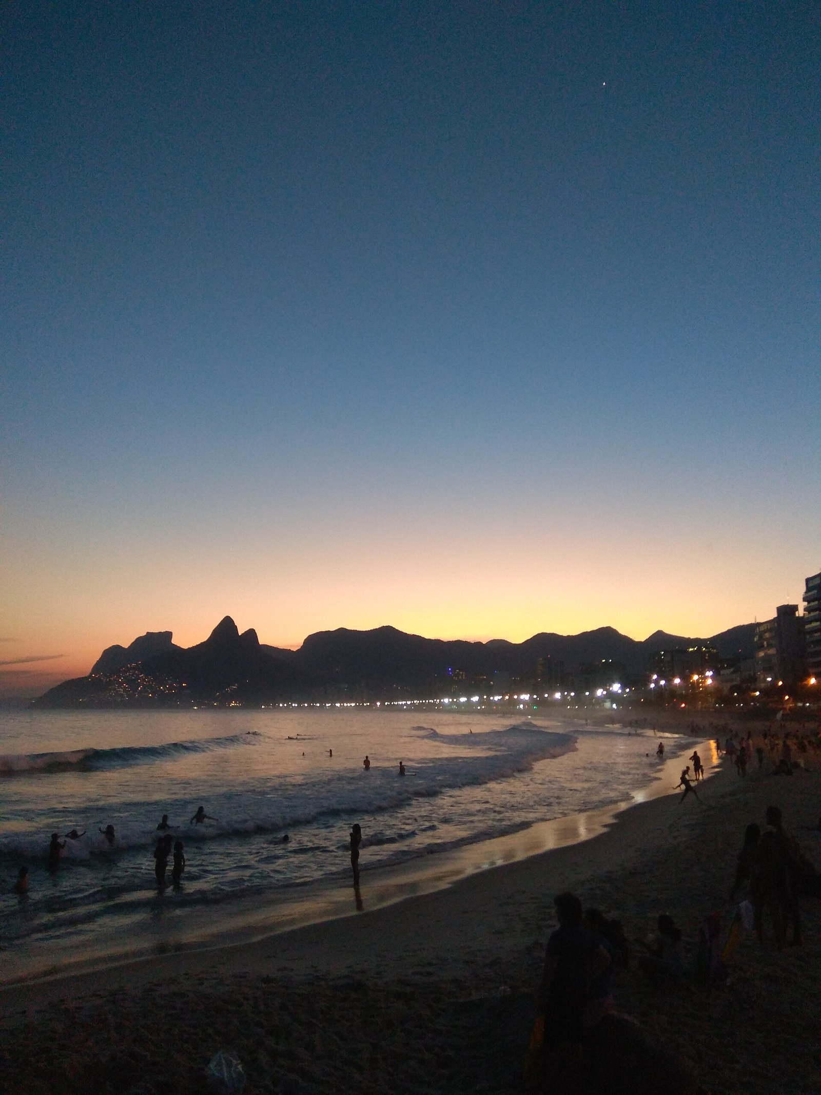 Sunset seen from Arpoador rock between Ipanema and Copacabana