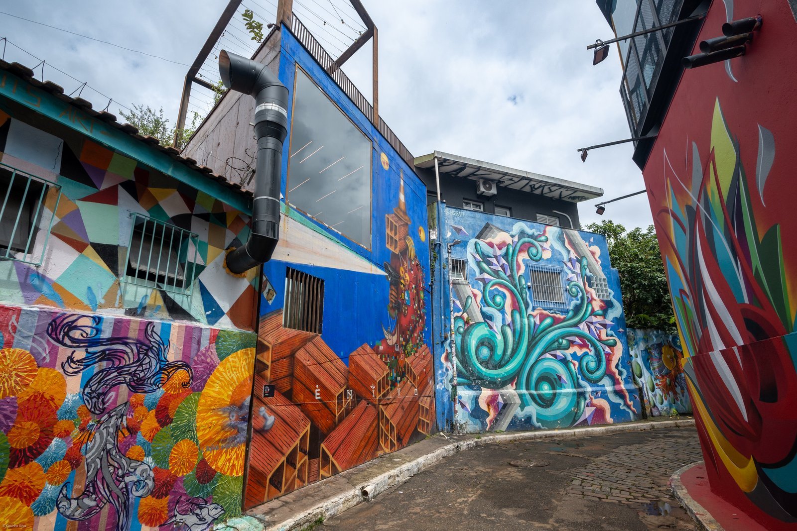 Walls and houses covered in colorful graffiti in Beco do Batman, Vila Madalena, São Paulo